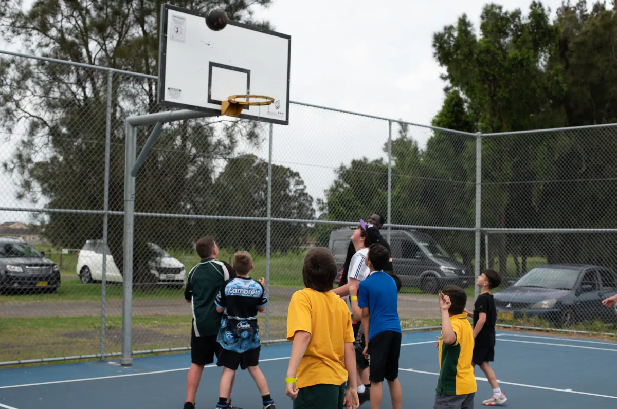 School children shoot hoops at Oakleigh Park